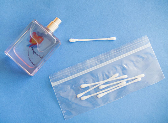 Spray cotton swabs with your perfume