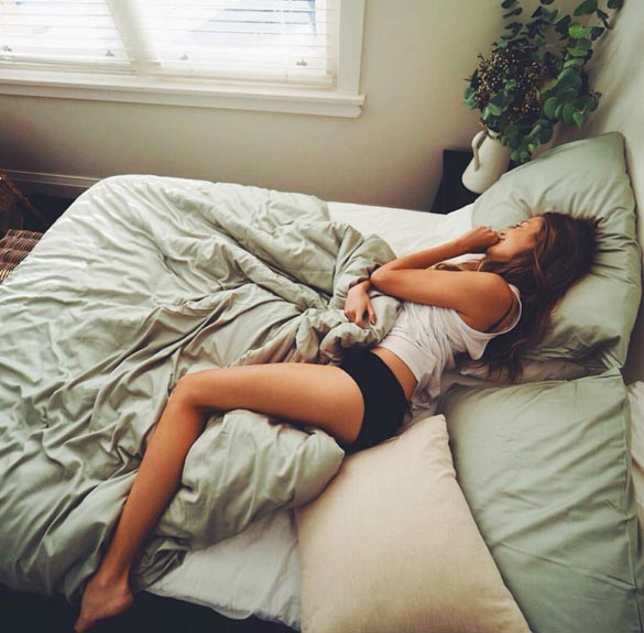 fit-girl-sleeping-in-her-bed