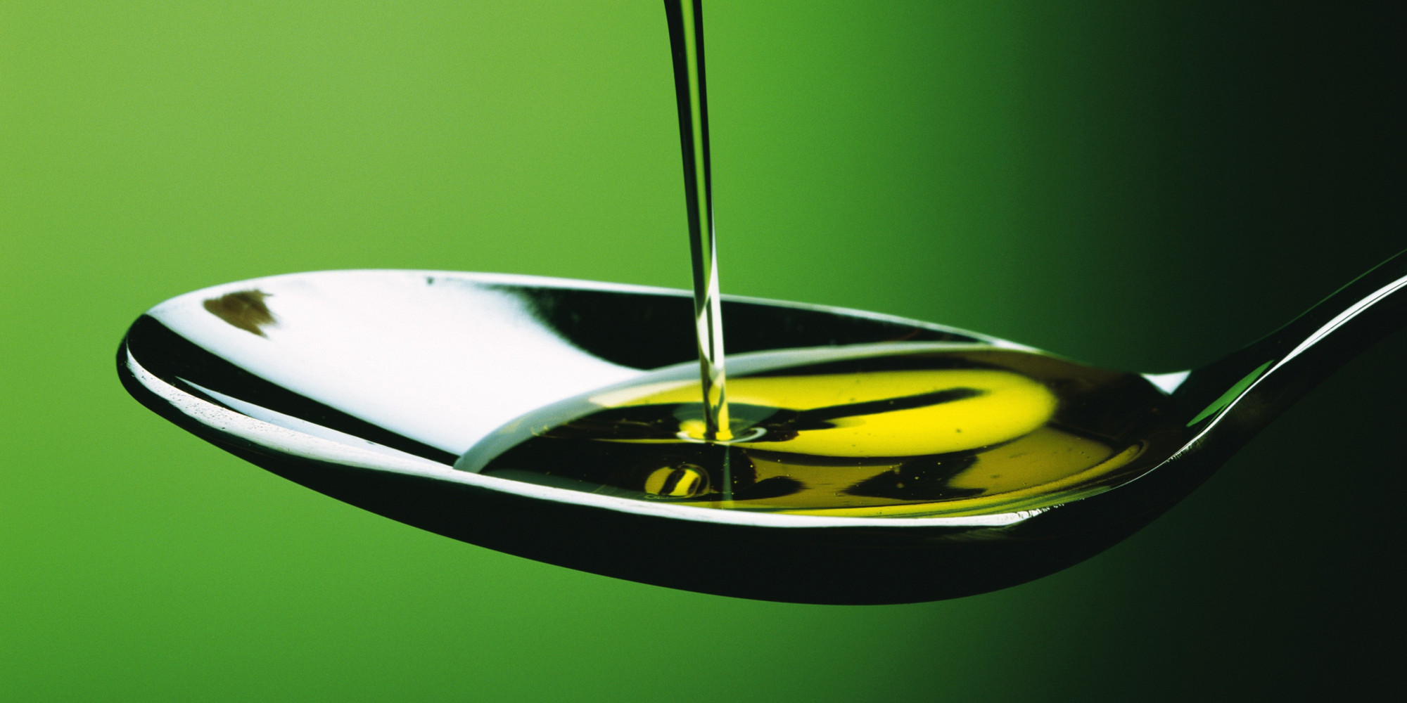 Oil That is Poured into a Spoon, Close Up, Front View