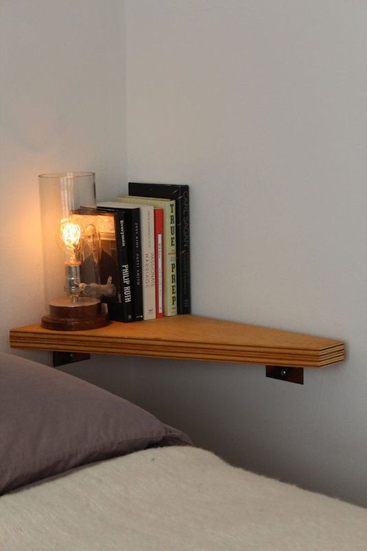7.-Install-a-corner-shelf-where-there-is-no-room-for-a-nightstand-29-Sneaky-Tips-For-Small-Space-Living