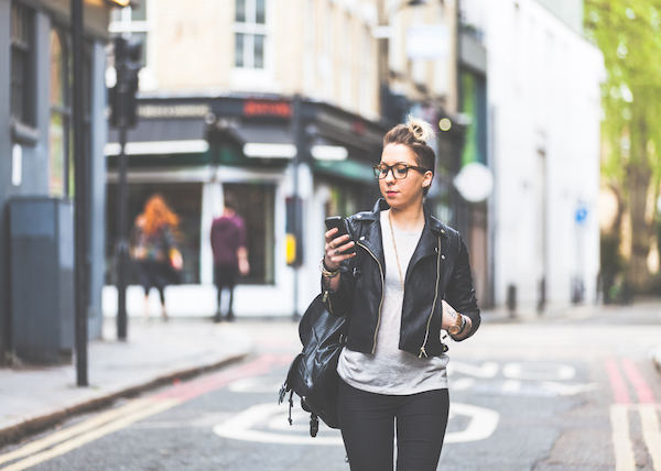 woman-phone-checking-looking-text-text-message-online-dating-technology-single-smile-think-