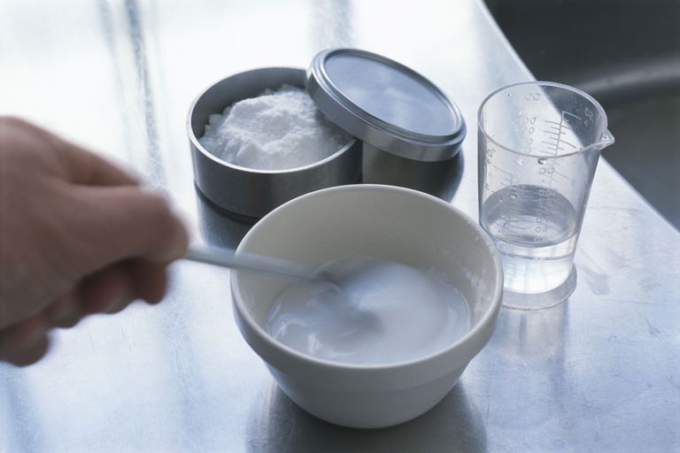 making-baking-soda-paste-mixing-powder-with-water-in-bowl-close-up-91995612-5752f1203df78c9b462b3f0a