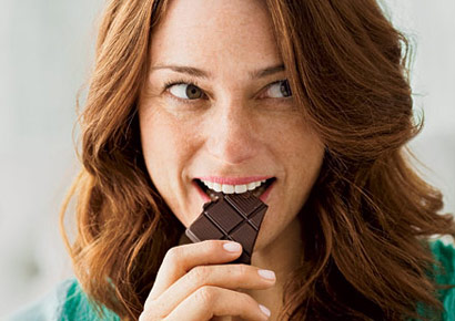 happy-woman-eating-chocolate-0710-410×290