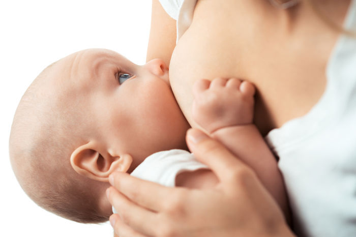 Baby feeds on MOM’s breasts