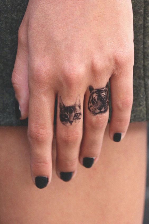 tatuaje de animales en la mano