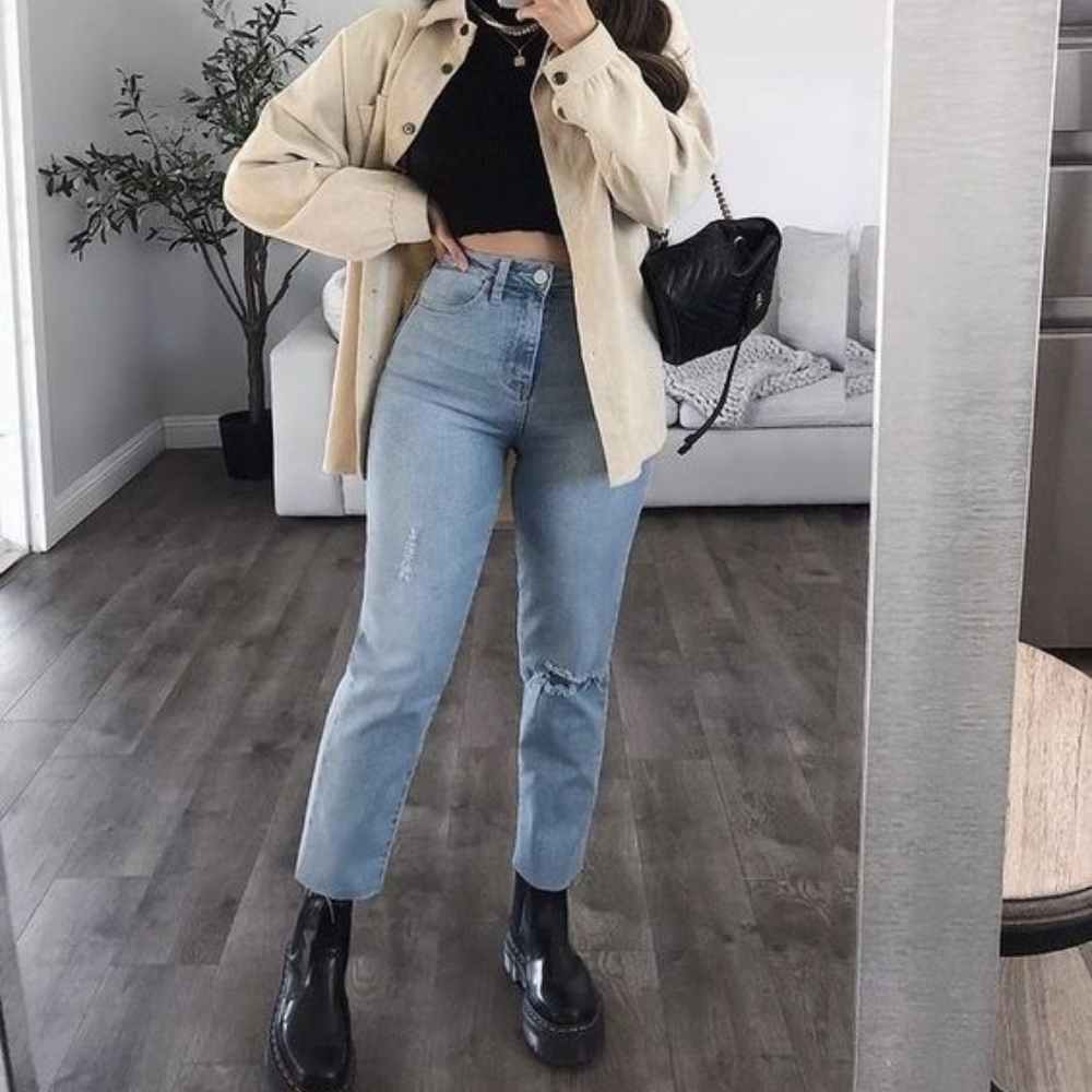 7 outfits para usar botas negras con jeans este invierno 5