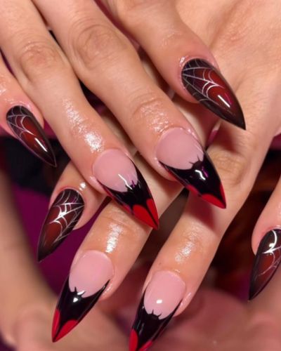 Tendencias de uñas para Halloween de murciélagos en rojo