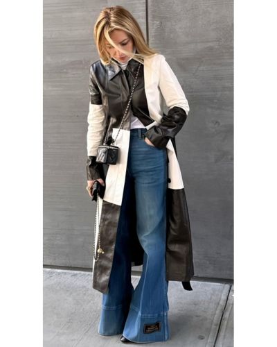 Foto de mujer usando un pantalón de mezcilla y una prenda de piel XXL en color blanco y negro